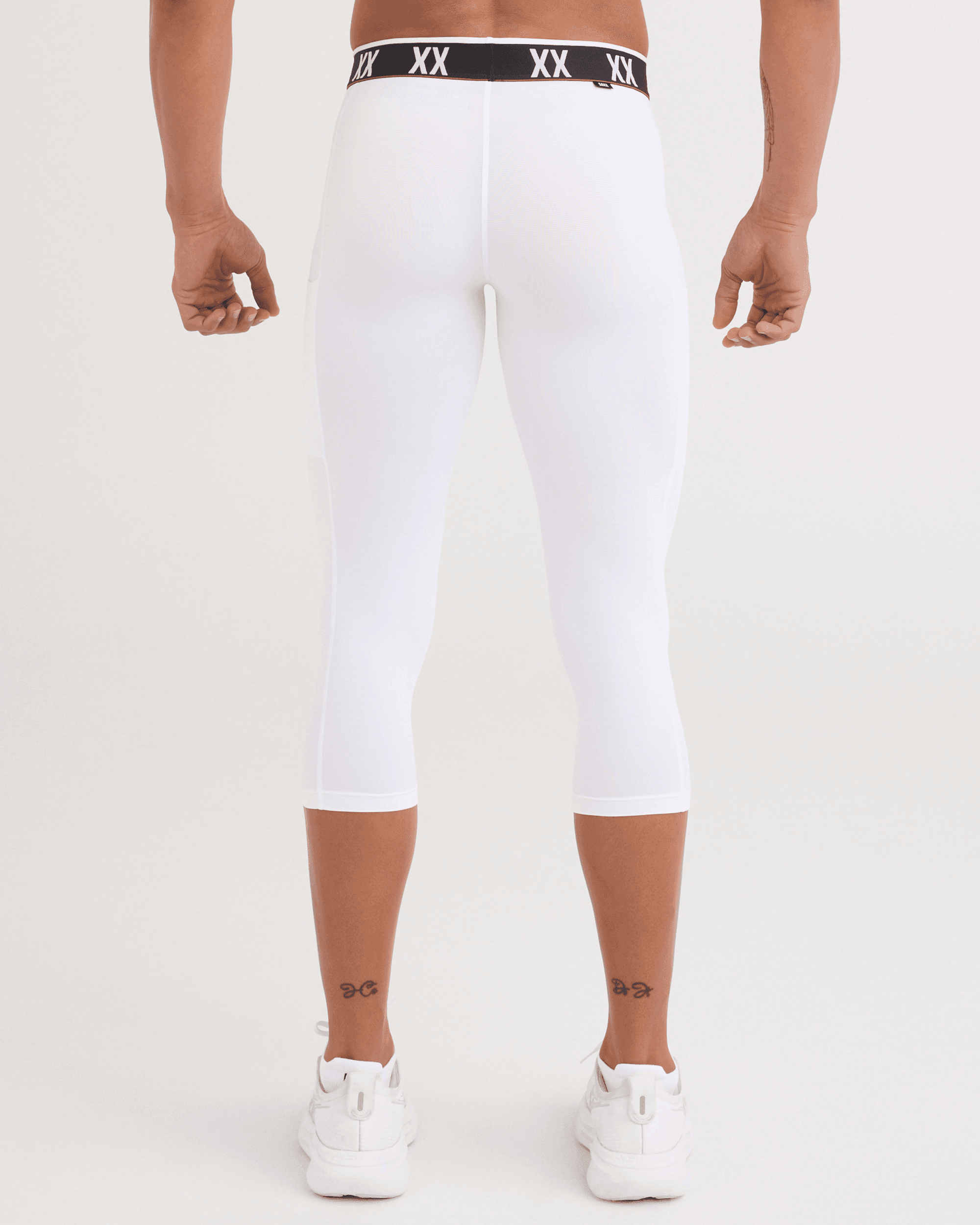Back - Model wearing Multi-Sport Mesh Tights in White