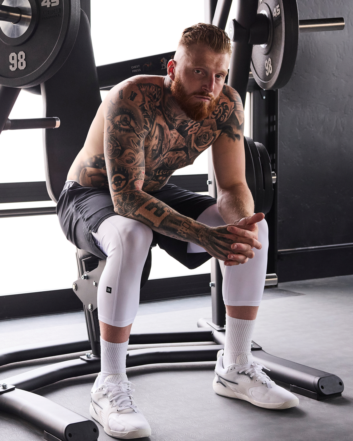 Maxx Crosby wearing SAXX Multi-Sport 3/4 Tights in White and Power Moves Shorts in Black