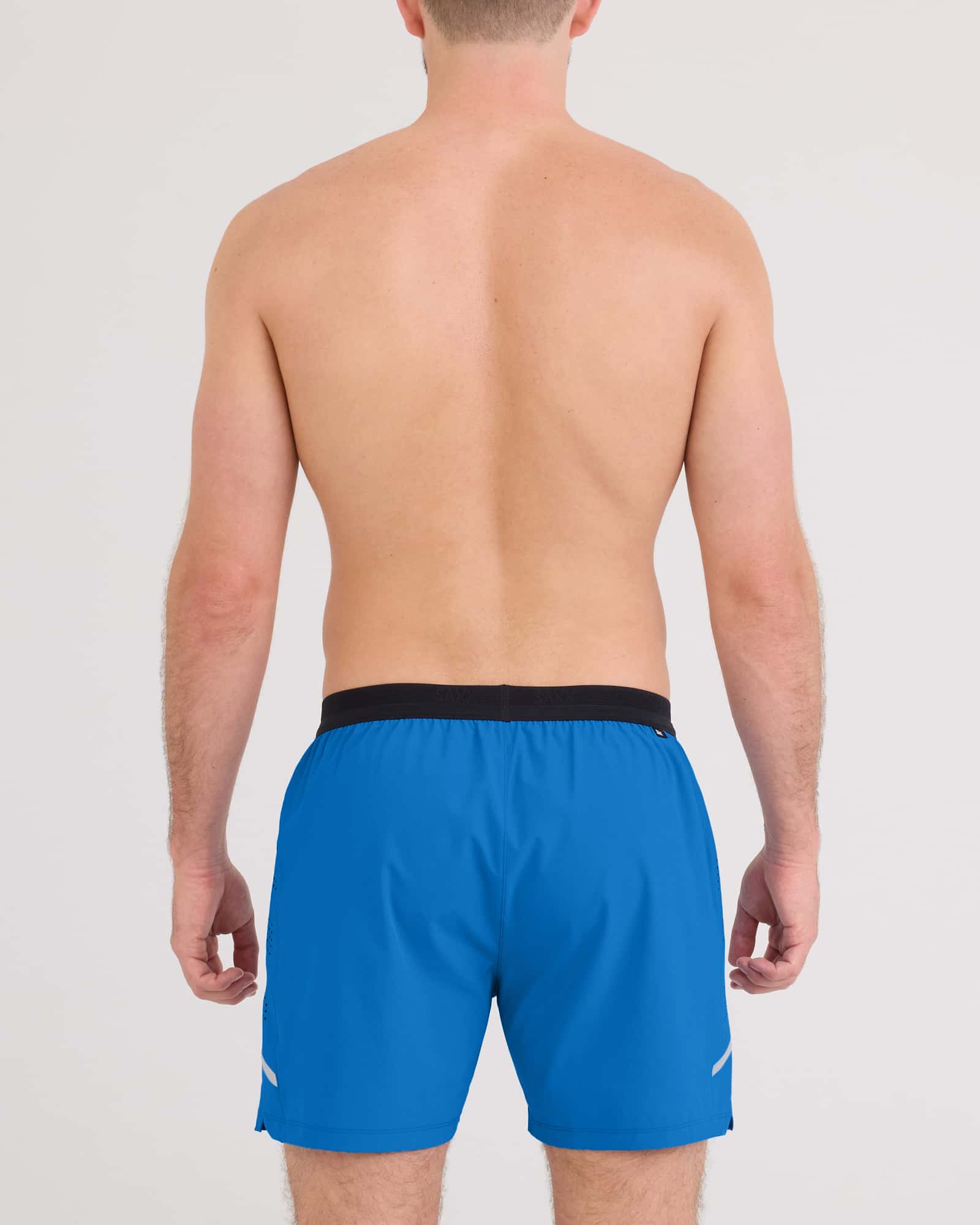 Back - Model wearing Run For All 2N1 Short 5" in Bold Blue