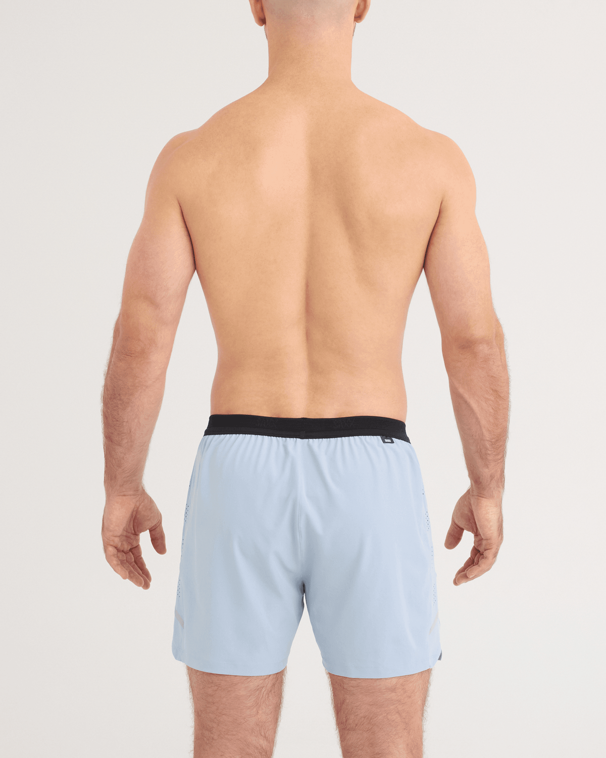 Back - Model wearing Run for All 2N1 Shorts 5" in Blue Fog