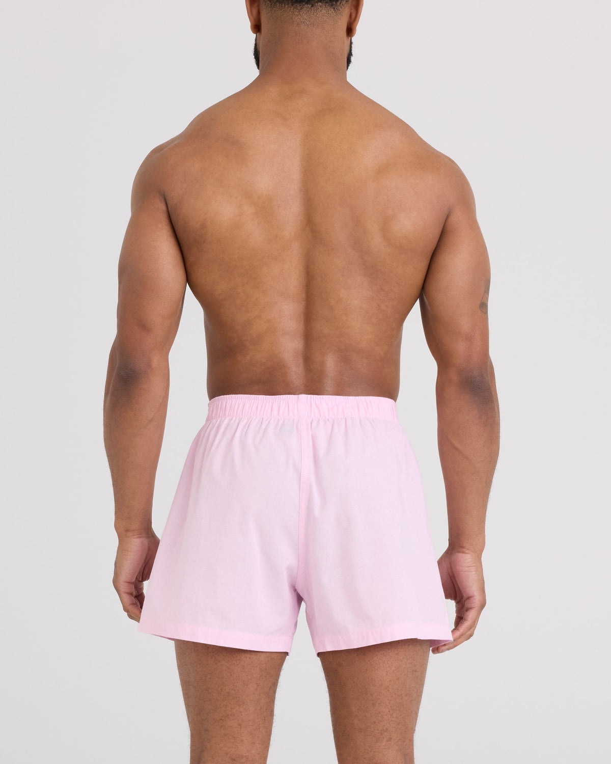 Back - Model wearing DropTemp Cooling Cotton Boxer Short in Chambray-Pink
