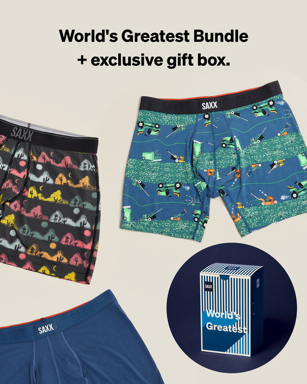 Three pairs of SAXX underwear with a 'World's Greatest Bundle' text and gift box on a beige background.
