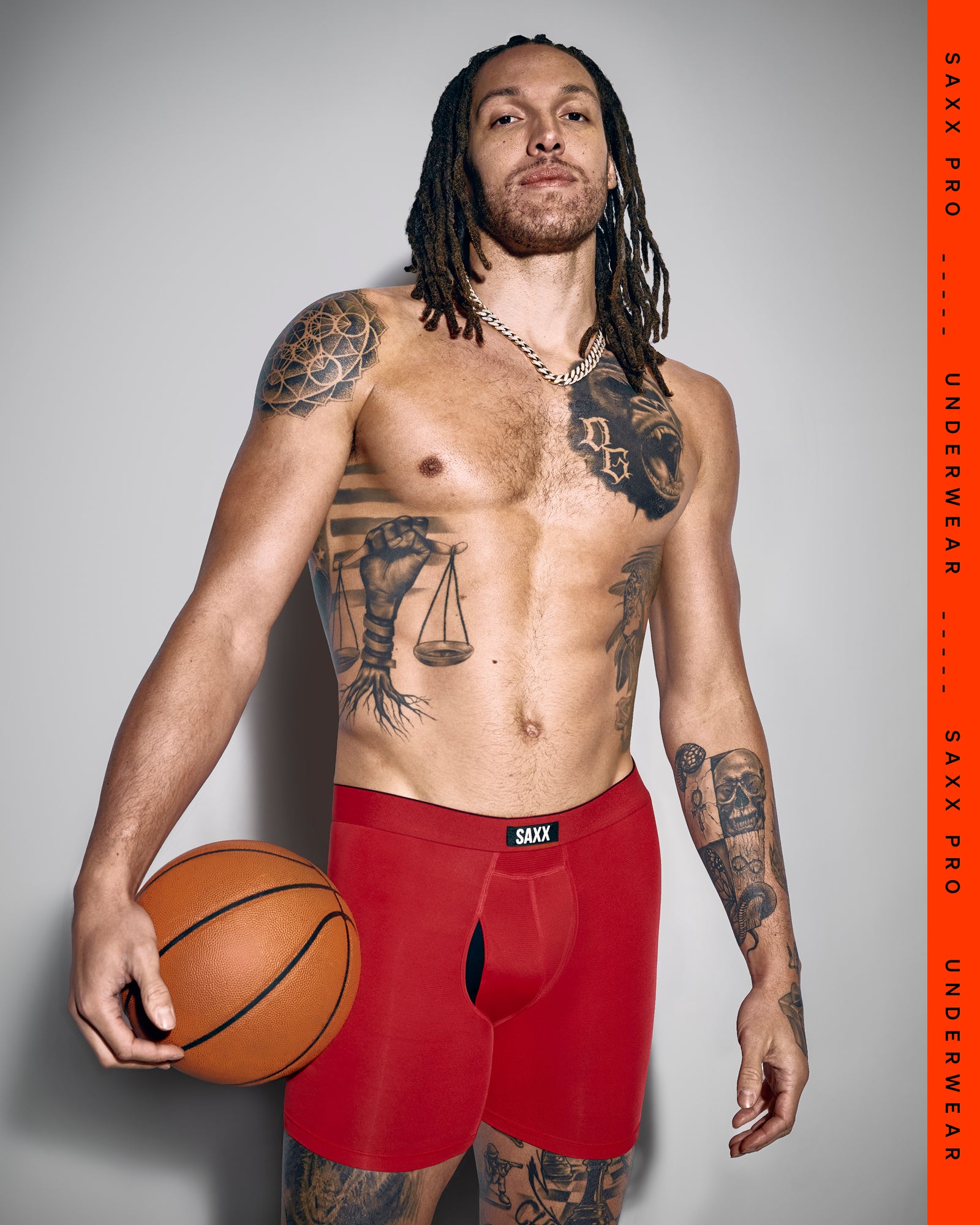 SAXX Gamechanger and Pro Basketball Player Aaron Gordon wearing Multi-Sport Mesh Boxer Brief in Sunset Red