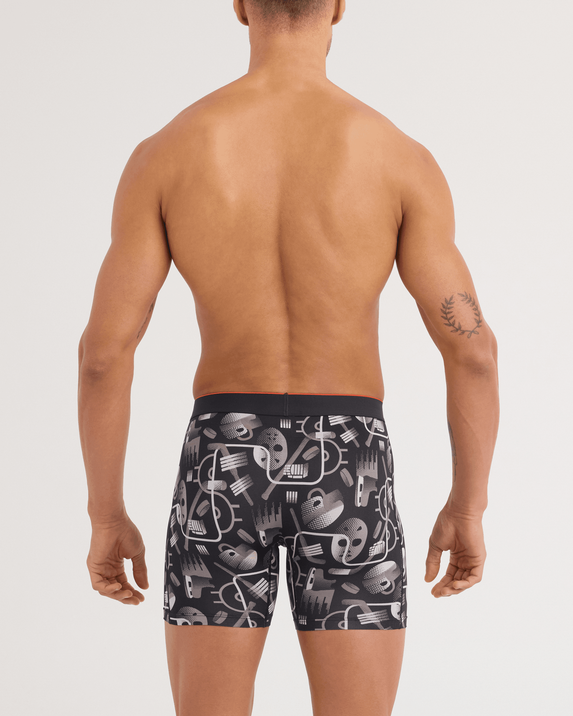 Back - Model wearing Multi-Sport Mesh Boxer Brief in Hockey Conduit-Black