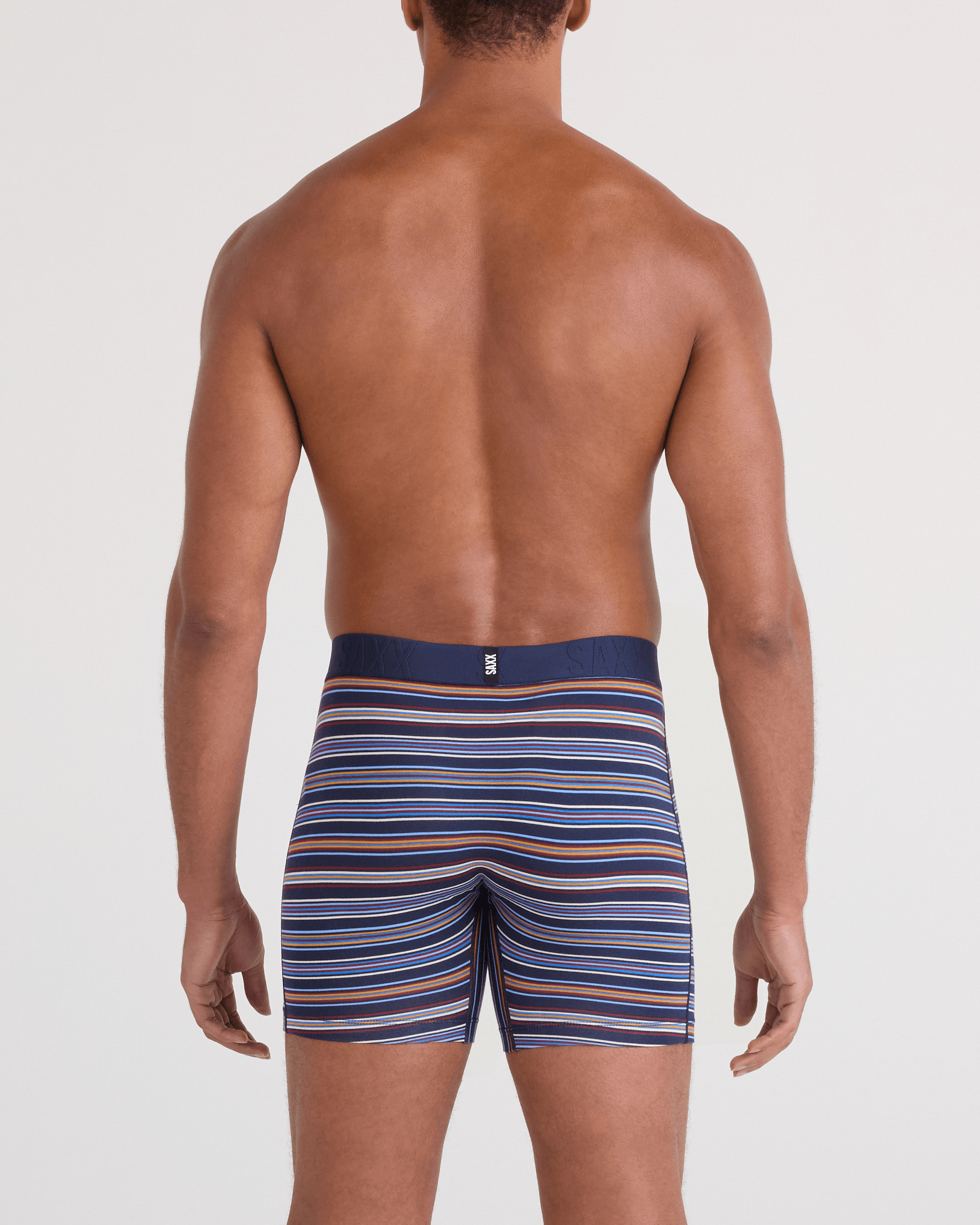 Back - Model wearing DropTemp Cooling Cotton Boxer Brief Fly in Vivid Stripe-Maritime