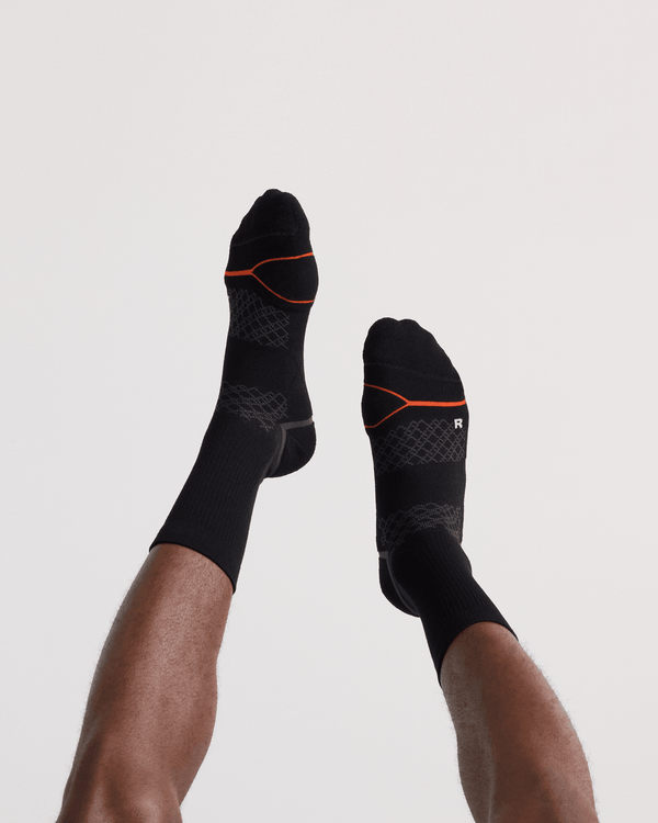 Back - Model wearing Foot Hold Mid-Weight Crew Sock in Black