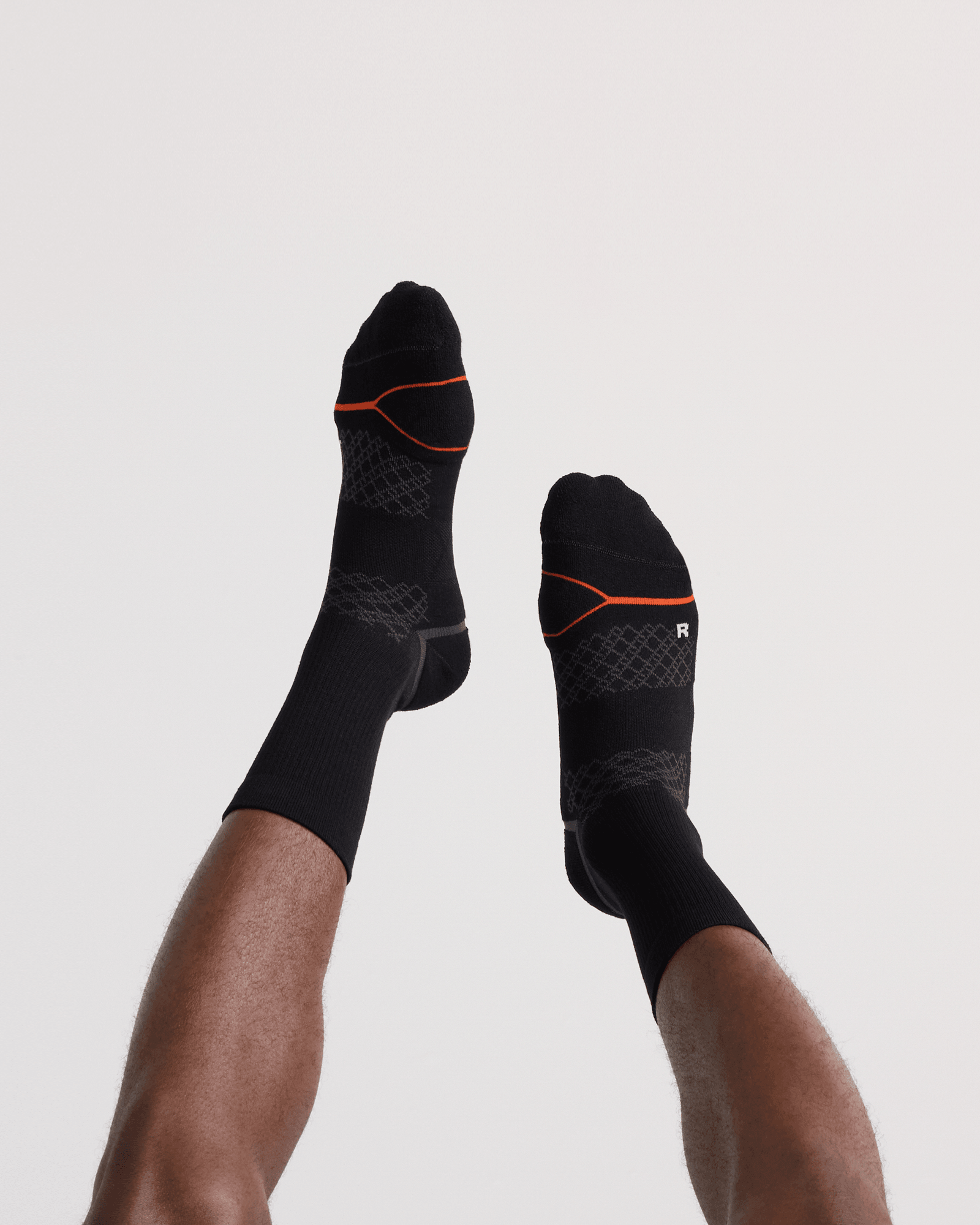 Back - Model wearing Foot Hold Mid-Weight Crew Sock in Black