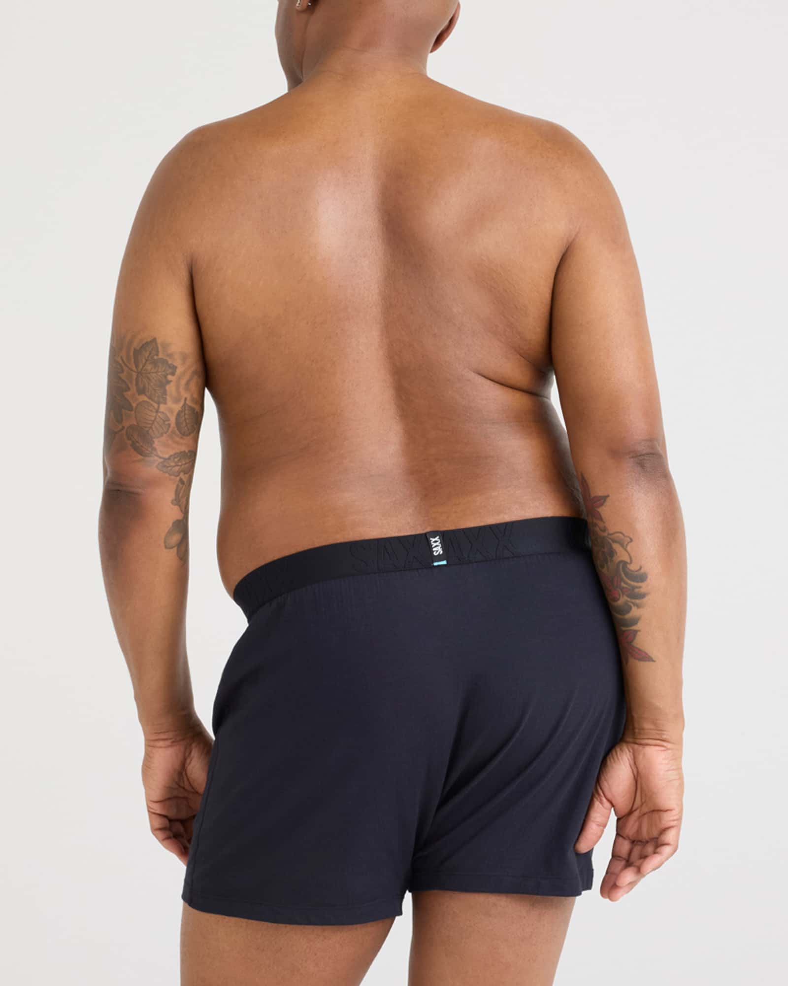 Back - Model wearing Droptemp Cooling Sleep Boxer Fly in Black