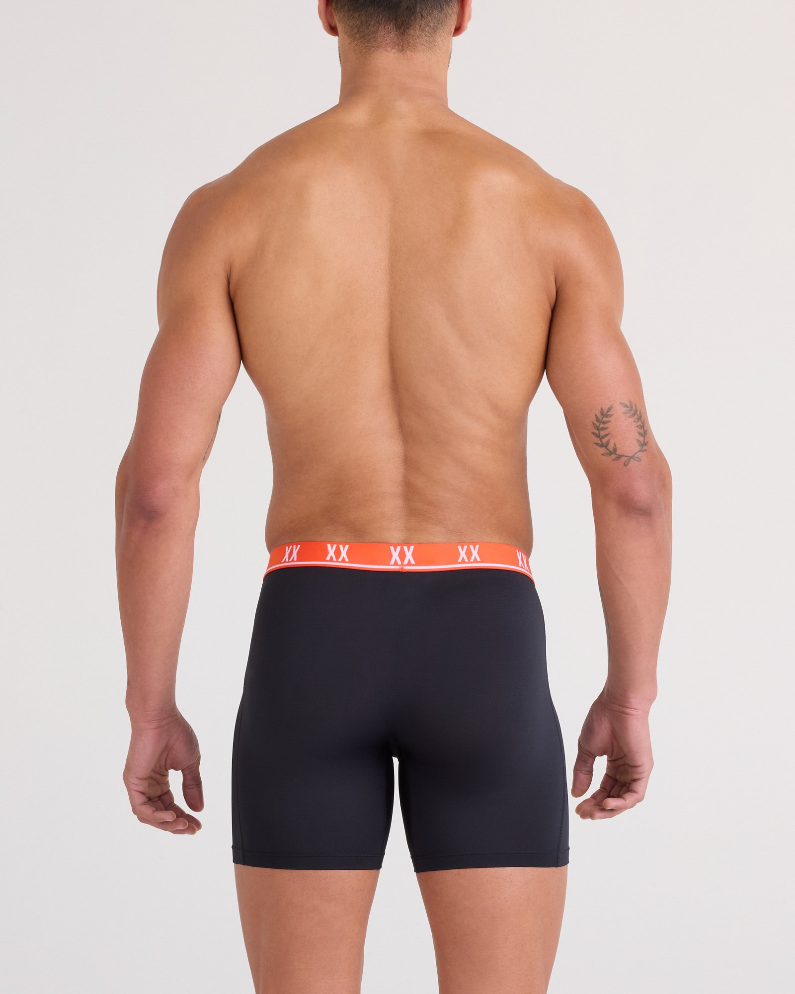 Back - Model wearing Essential Performance Mesh Boxer Brief in Black-Vermillion WB
