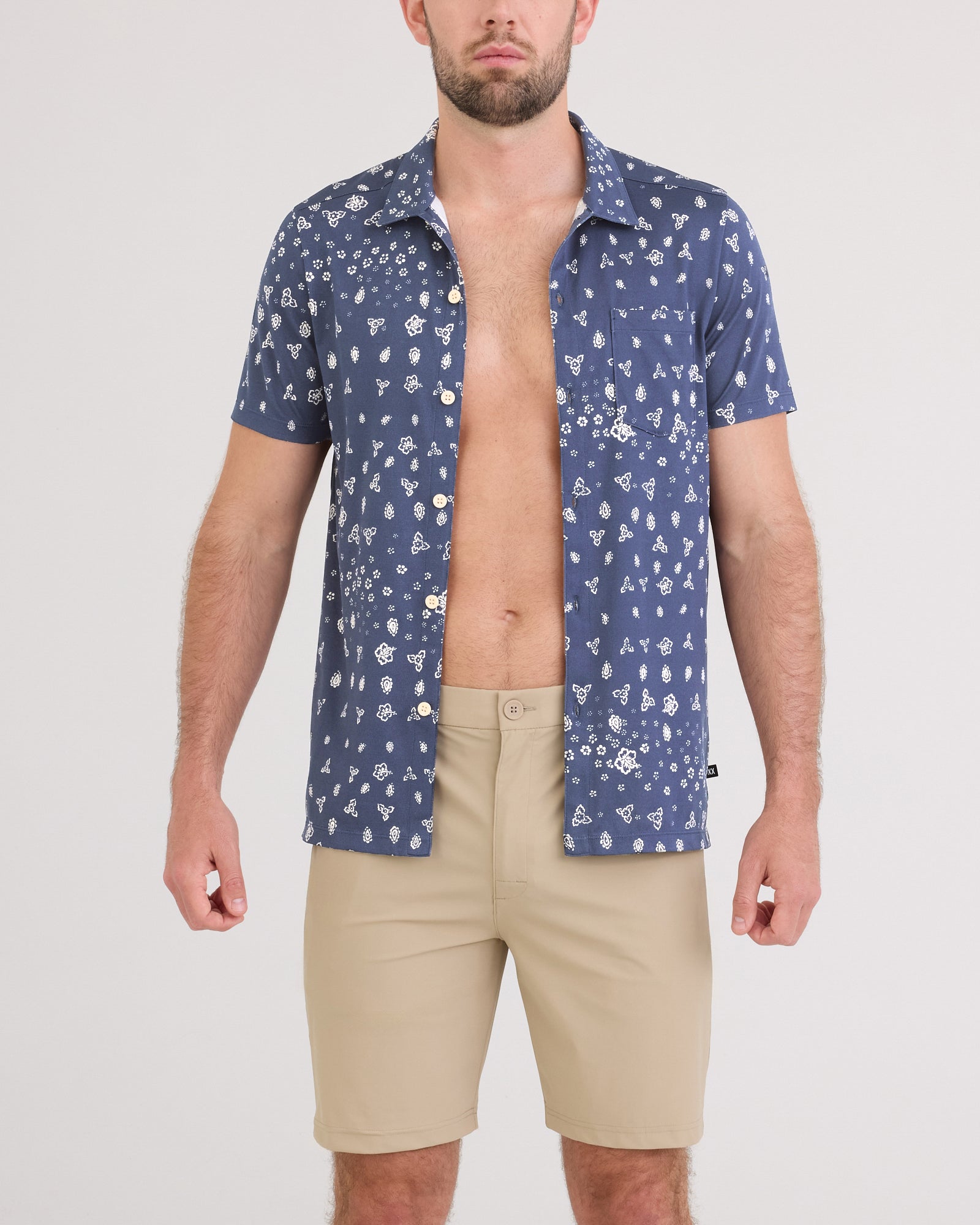 Front - Model wearing Droptemp Dry Resort Polo in Bandana Tropic-Indigo