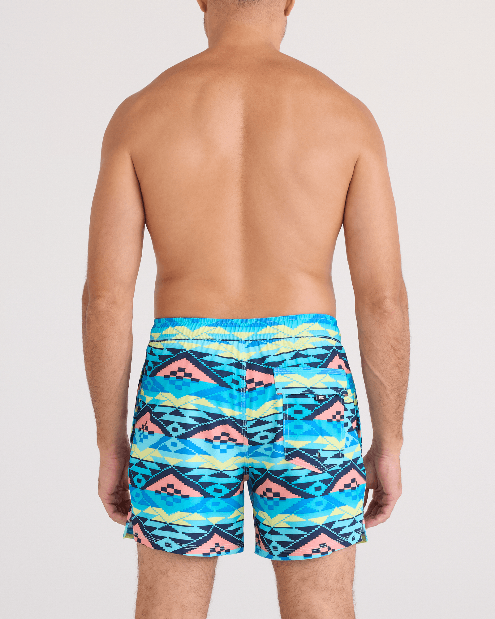 Back - Model wearing Oh Buoy 2N1 Swim Trunk 5" in Geo Gradient-Aqua