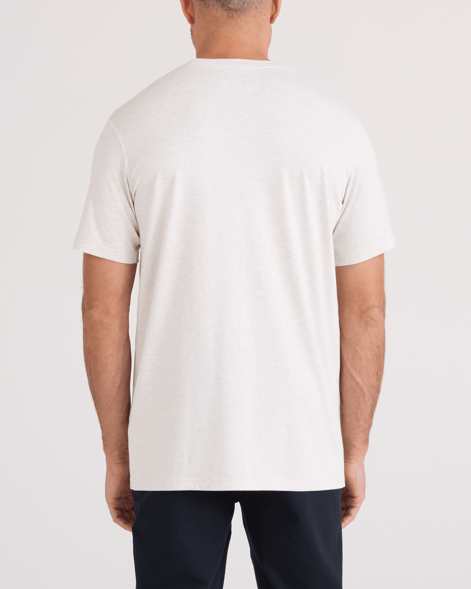 Back - Model wearing DropTemp Cooling Cotton Tee in Steel Heather