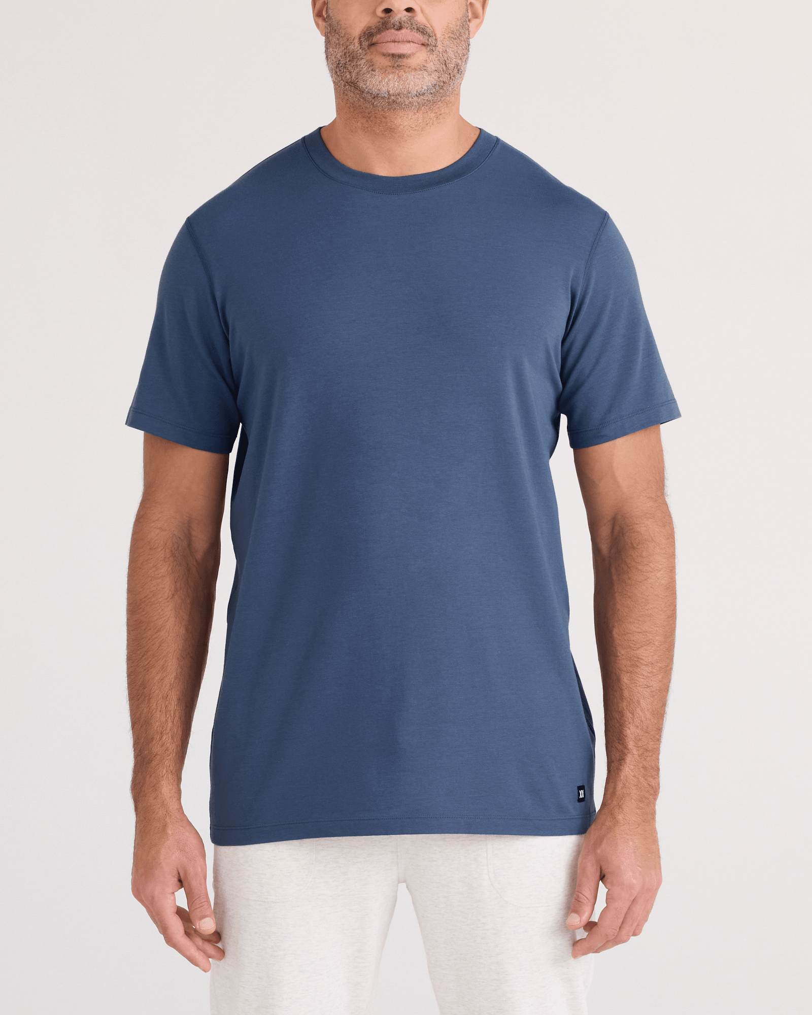 Front - Model wearing DropTemp Cooling Cotton Tee in Washed Indigo