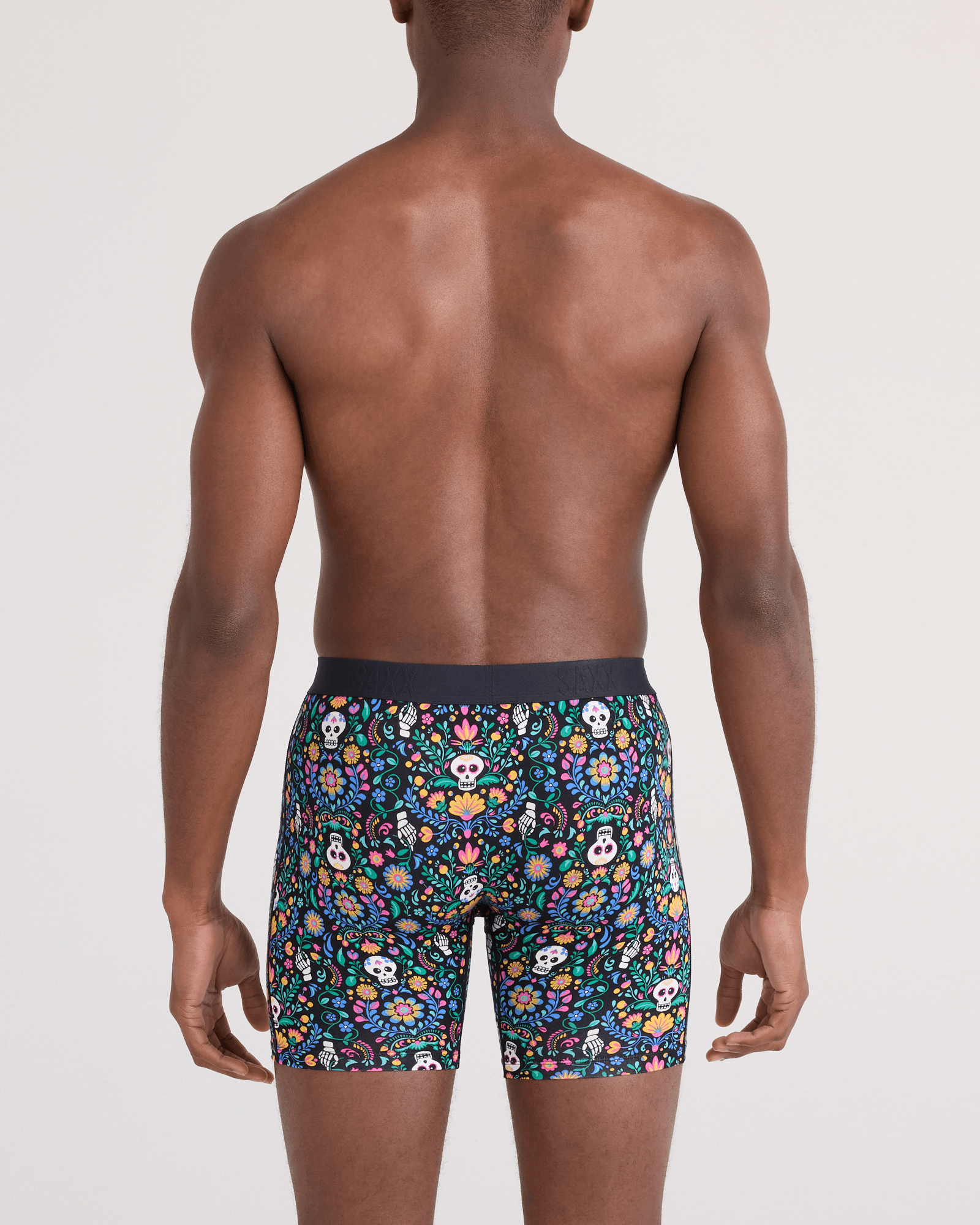 Back - Model wearing Vibe Xtra Soft Comfort Boxer Brief Fly in Skull Garden-Multi