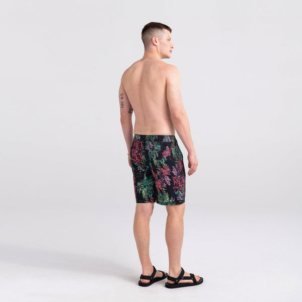 Back - Model wearing Betawave 2N1 Swim Short Long in Midnight Tropics- Multi