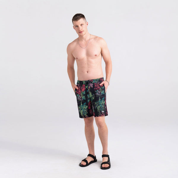 Front - Model wearing Betawave 2N1 Swim Short Long in Midnight Tropics- Multi