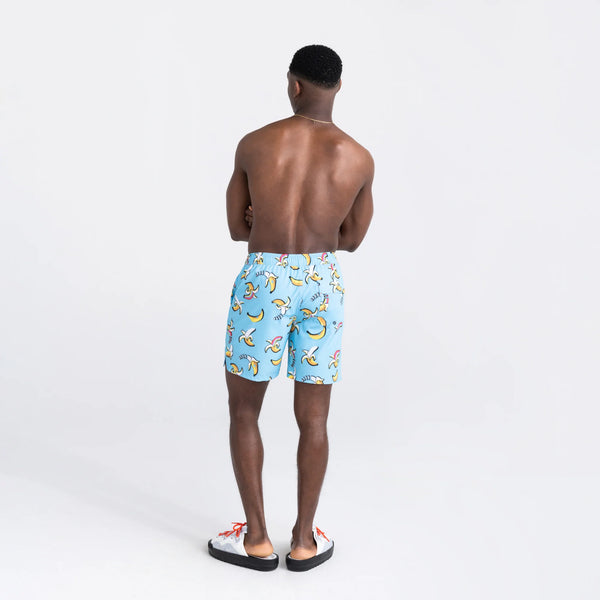 Back - Model wearing Oh Buoy 2N1 Swim Volley Short 7" in Rainbow Bananas- Azure