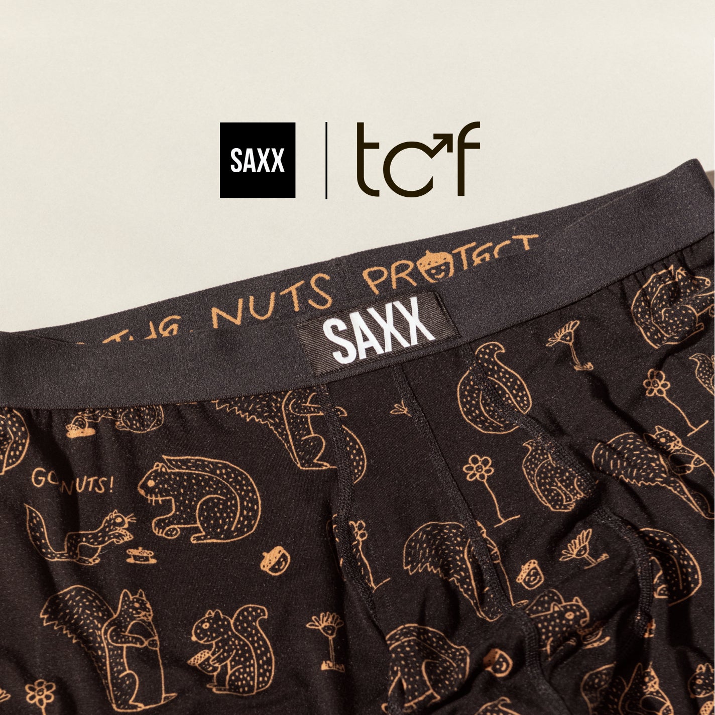 SAXX and Testicular Cancer Foundation logos overlaying a photo of black boxer briefs in a squirrel print