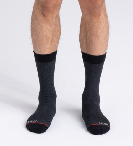 Photo of man's feet with black crew socks