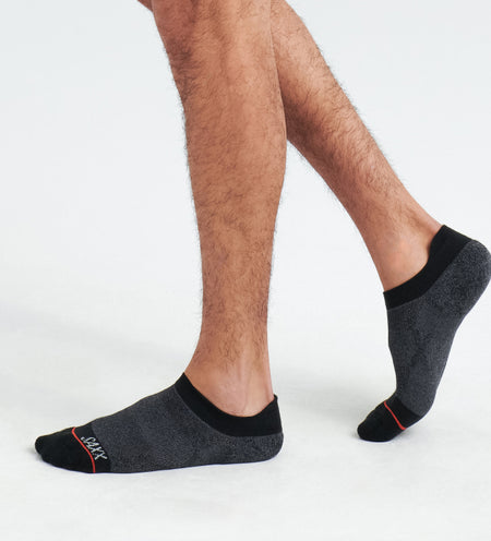 Photo of man's feet with black ankle socks