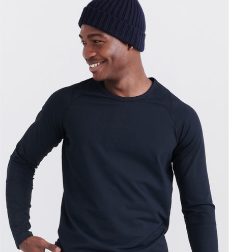 Man wearing black baselayer top and a beanie