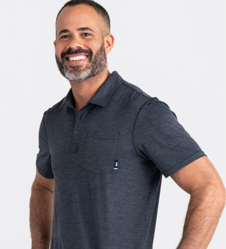Man wearing navy polo shirt 
