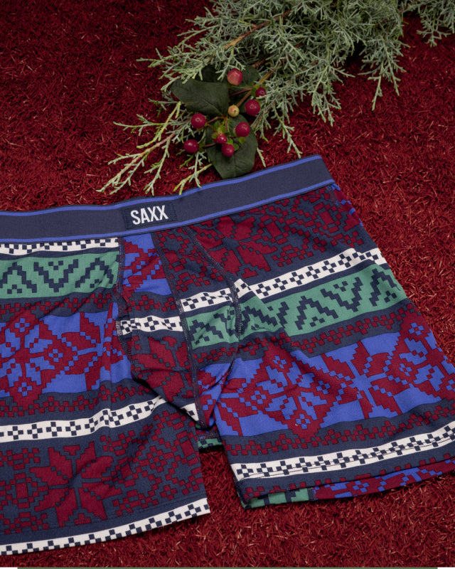 A close up image of a pair of underwear with a multi-colored fair-isle design printed on them.
