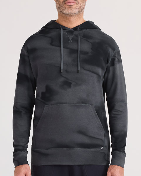 Person wearing a black hoodie on a white background