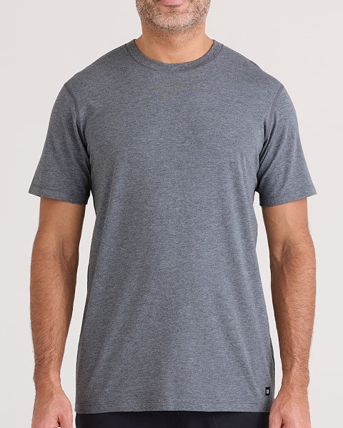 Man wearing a gray t-shirt against a white background