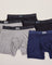 Five pairs of SAXX Boxer Briefs in blacks, greys, and navy, laid out flat over white backdrop.