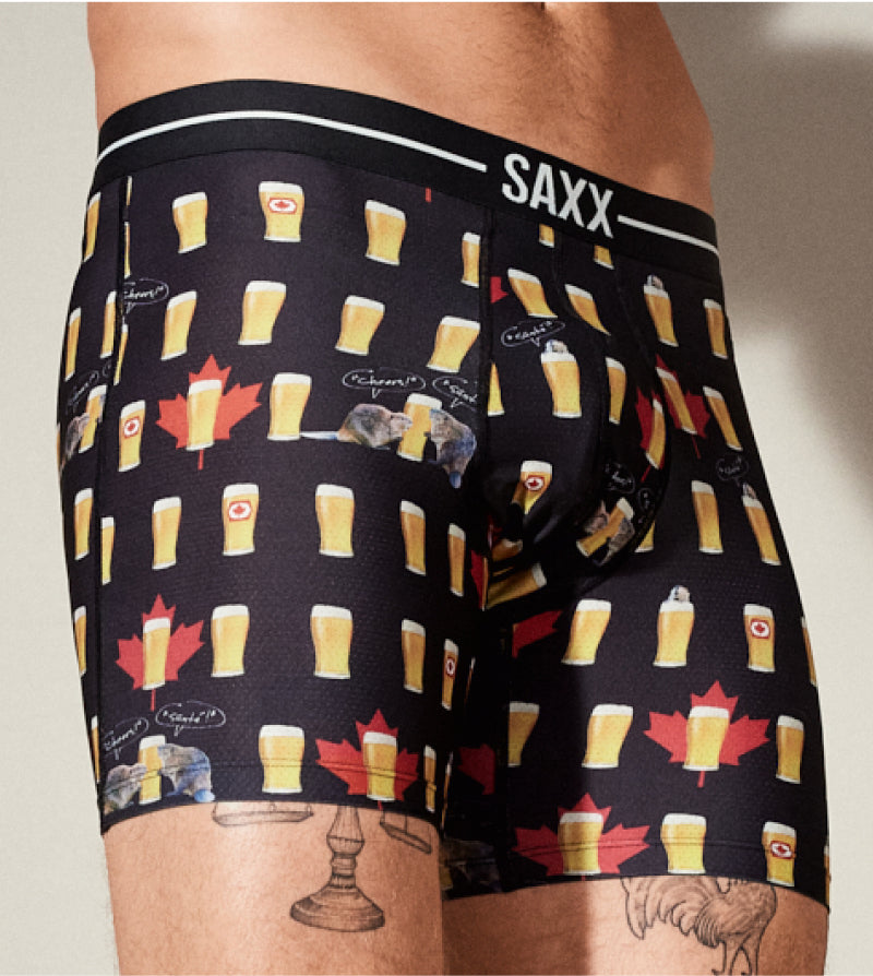 Men's underwear with beer and maple leaf pattern, brand 'SAXX' visible