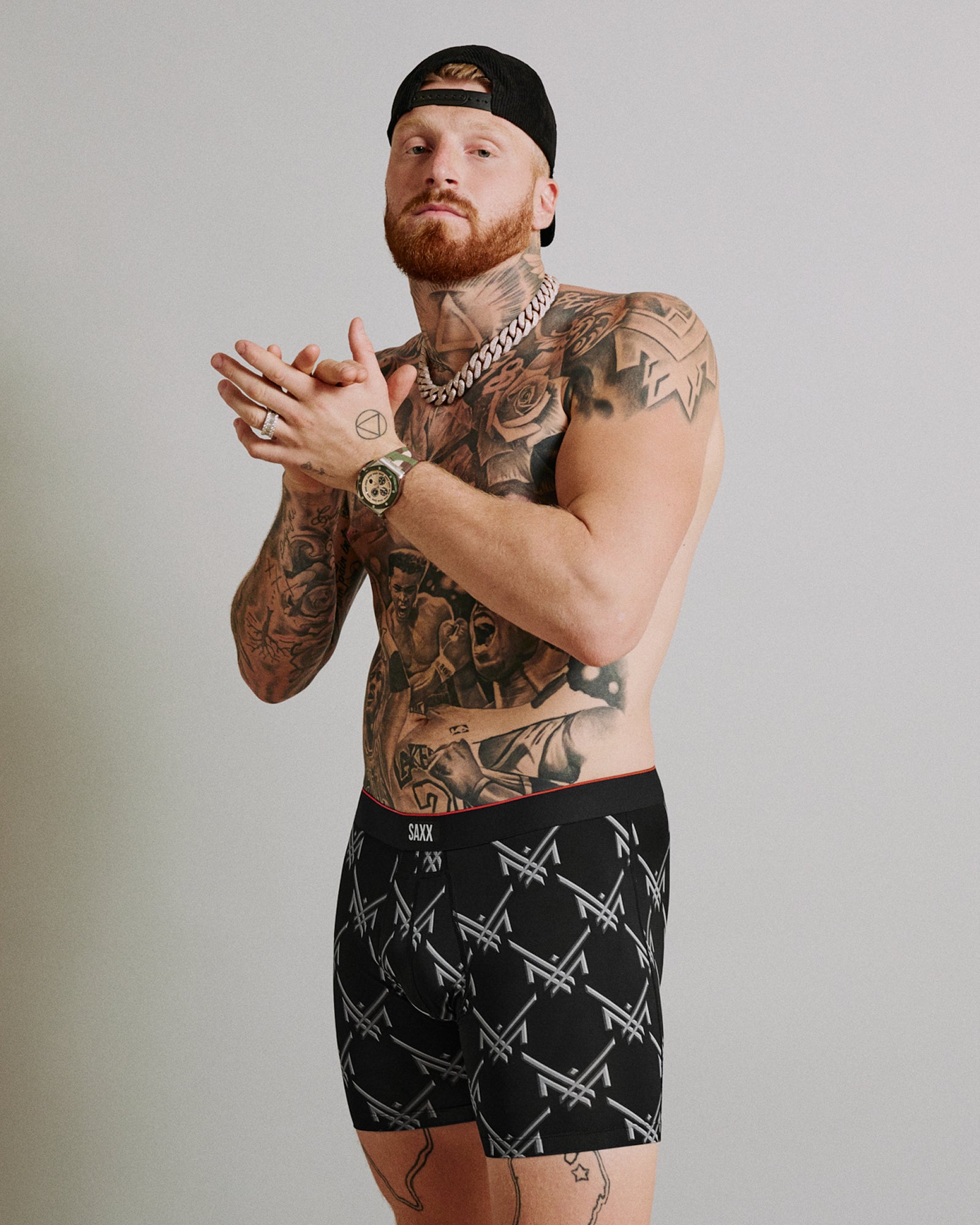 Maxx Crosby wearing his limited edition SAXX Underwear print, Multi-Sport Mesh Boxer Brief Fly in Maxx Luxx Logo-Black