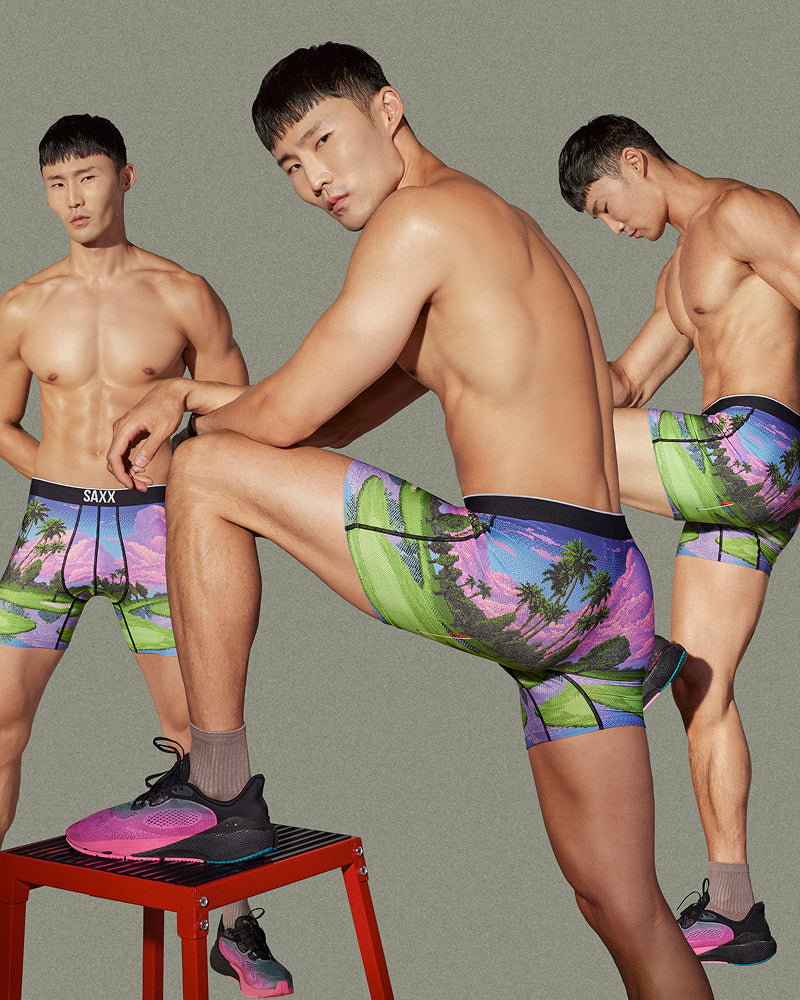 A man repeated three times wearing bright printed underwear.