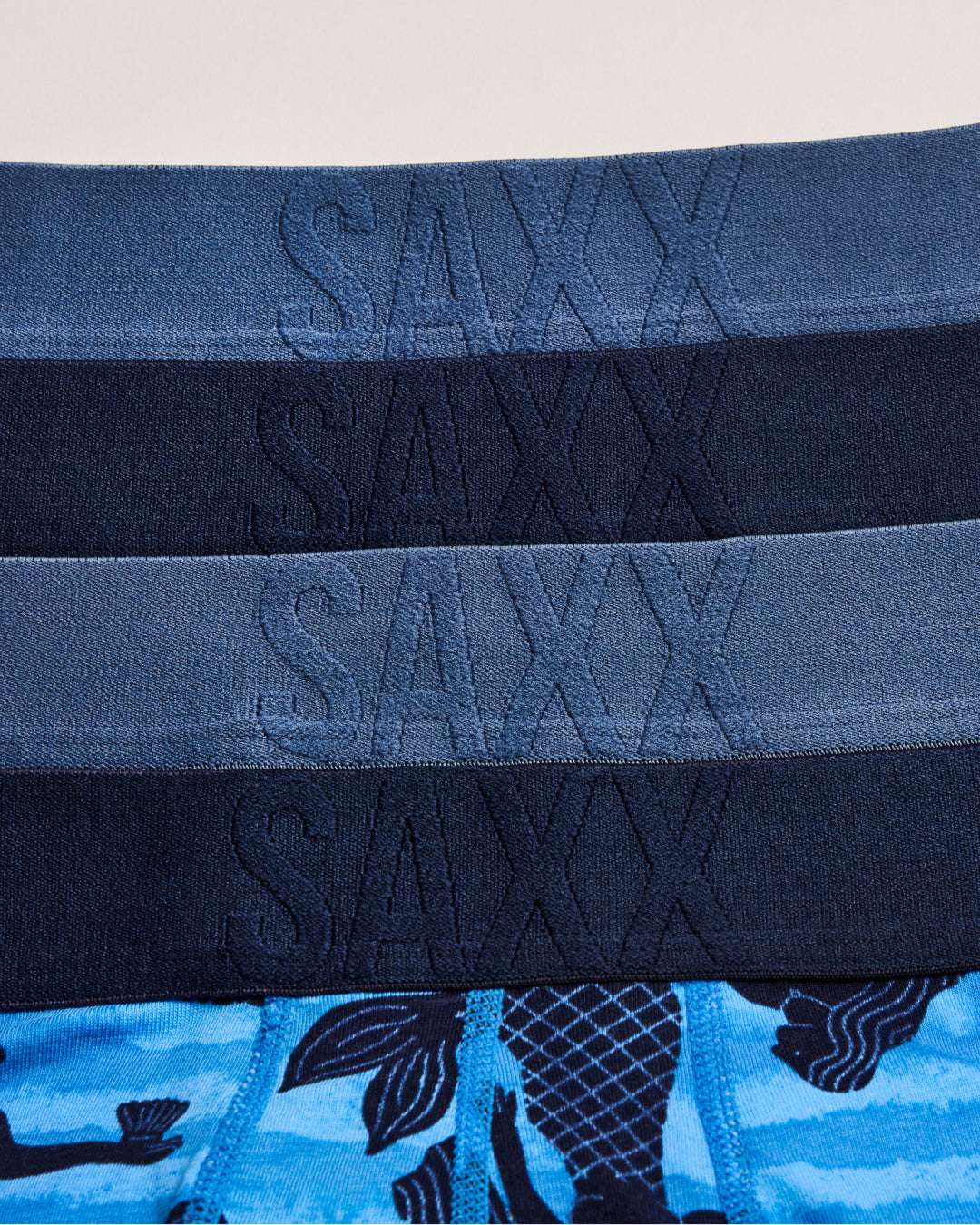 Stack of Saxx underwear with whale pattern