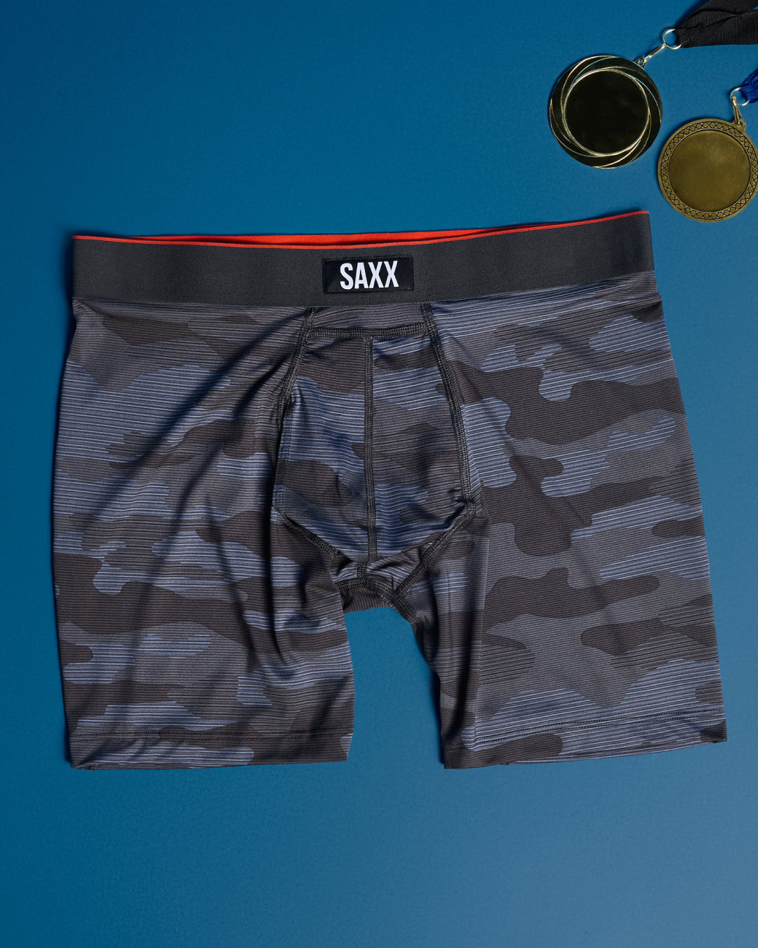 Camouflage boxer briefs with SAXX branding on a blue background