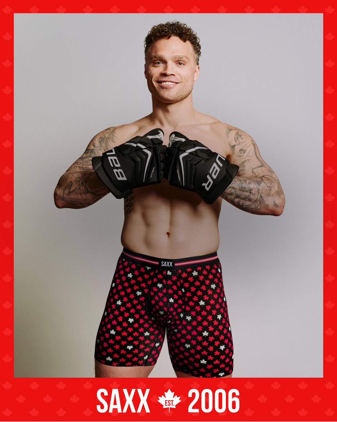 SAXX Gamechanger and Professional Hockey Player Max Domi wearing SAXX underwear and boxing gloves with a red border and SAXX logo.