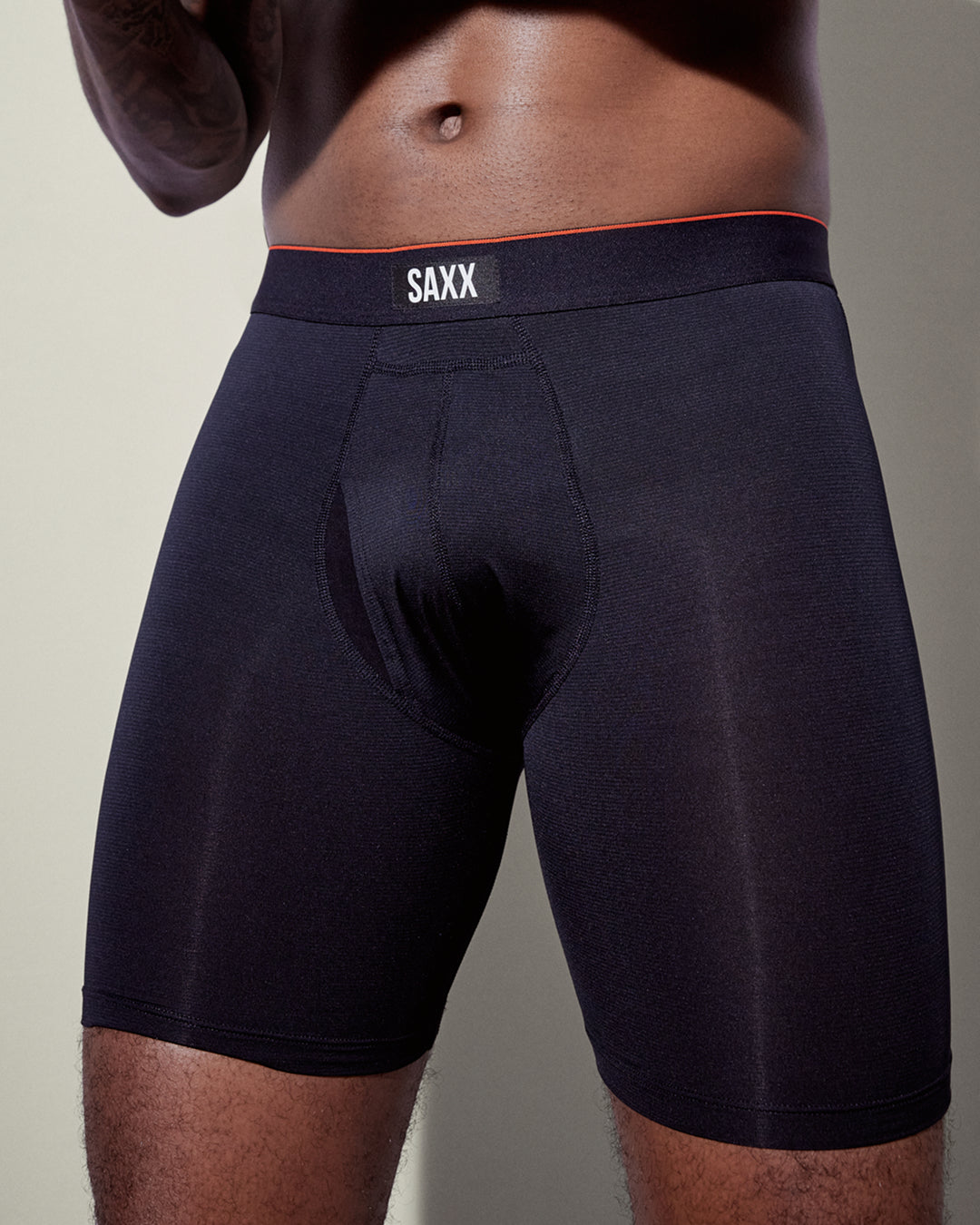 Black SAXX boxer briefs worn by a person on a neutral background