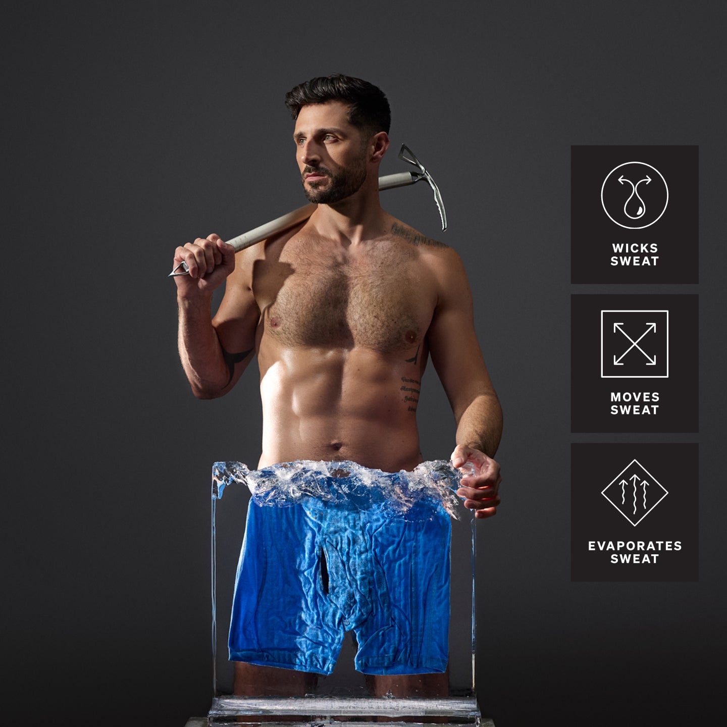 Model standing holding an ice pick in front of pair of blue underwear in block of ice with product tech features to the right