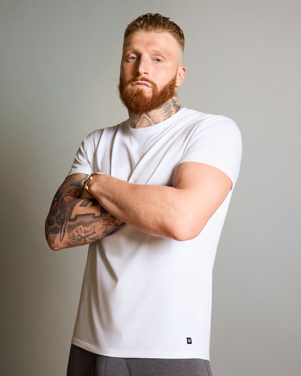 Maxx Crosby wearing SAXX DropTemp Dry Cotton Crew Neck Undershirt in White