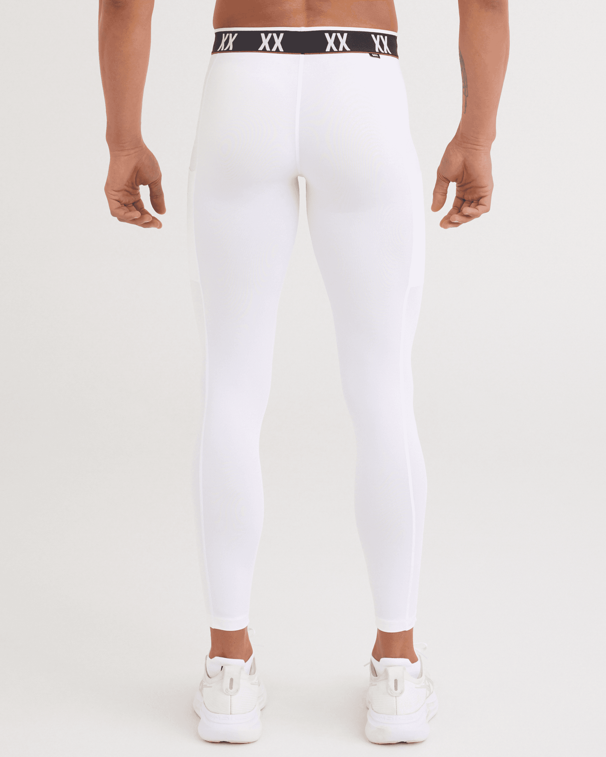 Back - Model wearing Multi-Sport Mesh Tights in White