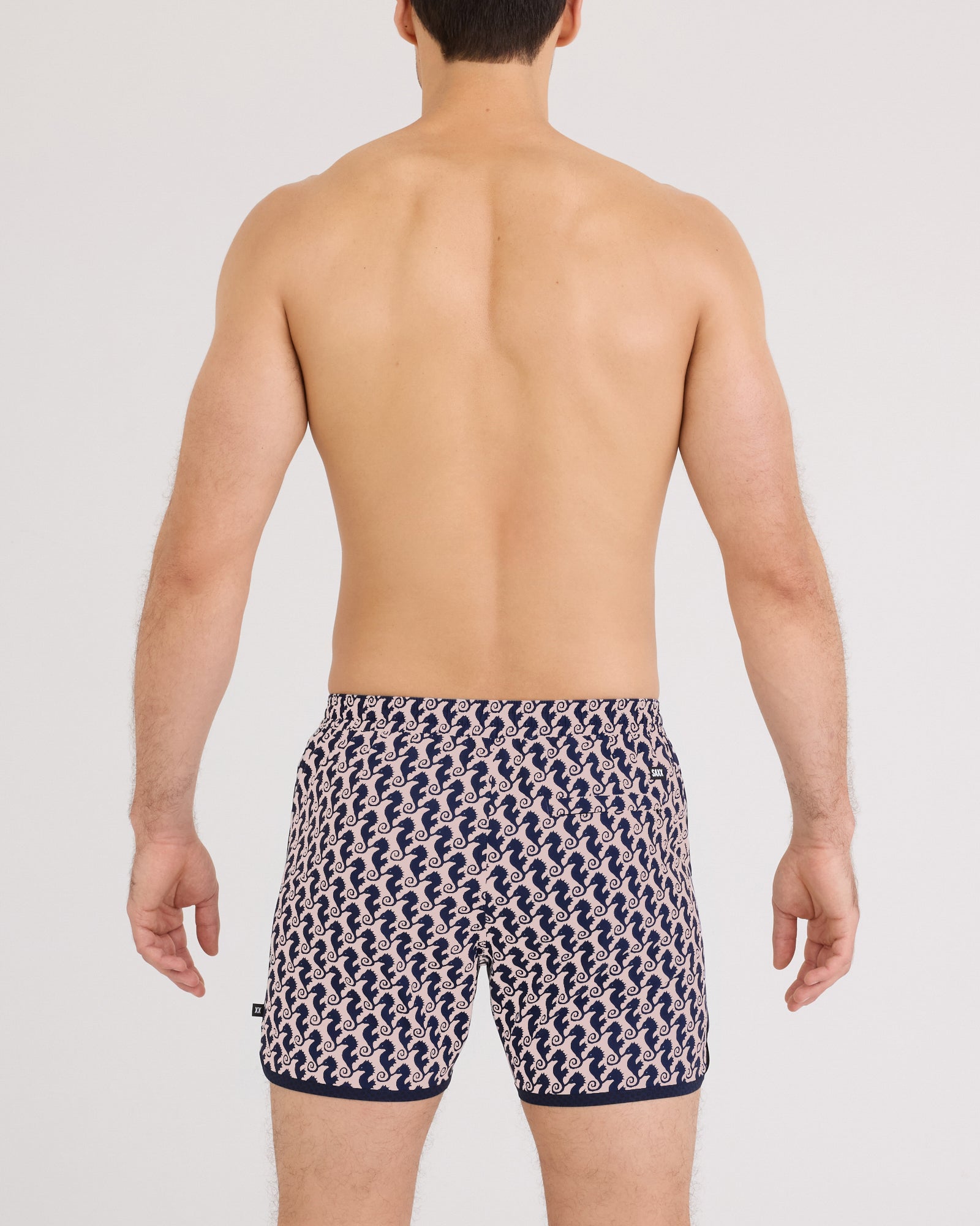 Back - Model wearing Harbormaster 2N1 Trunk 5" in Seahorse Chain-Light Coral
