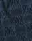 Close-up of fabric with geometric XX  pattern on a black background