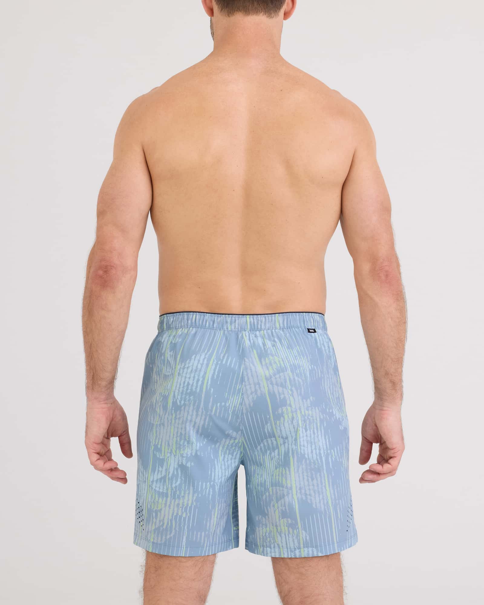 Back - Model wearing Power Moves 2N1 Short 7" in Palm Screen-Faded Denim