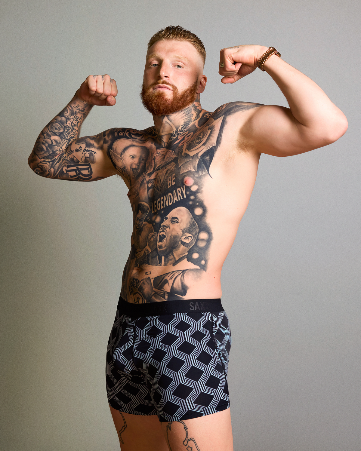 Maxx Crosby wearing SAXX Smooth Flex Boxer Brief in Prestige Check-Black