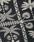 Black fabric with white palm tree and geometric pattern