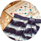 Blue Boxer Briefs in a wintery print draped over a Scrabble board