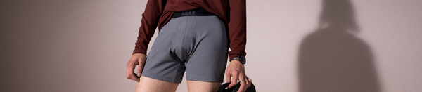 Man in grey loose fit boxers and red shirt