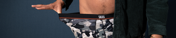 Man in camo underwear snapping waistband