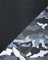 Close-up of black textured fabric and camouflage-patterned fabric