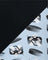 Fabric with hockey goalie pattern on a black and light blue background